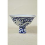 A Chinese Ming style blue and white porcelain stem bowl with dragon decoration, 6 character mark
