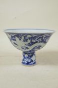 A Chinese Ming style blue and white porcelain stem bowl with dragon decoration, 6 character mark