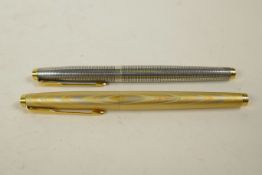 A sterling silver Parker '75' Cisele fountain pen with a 14ct nib, and an 18ct gold filled Parker '