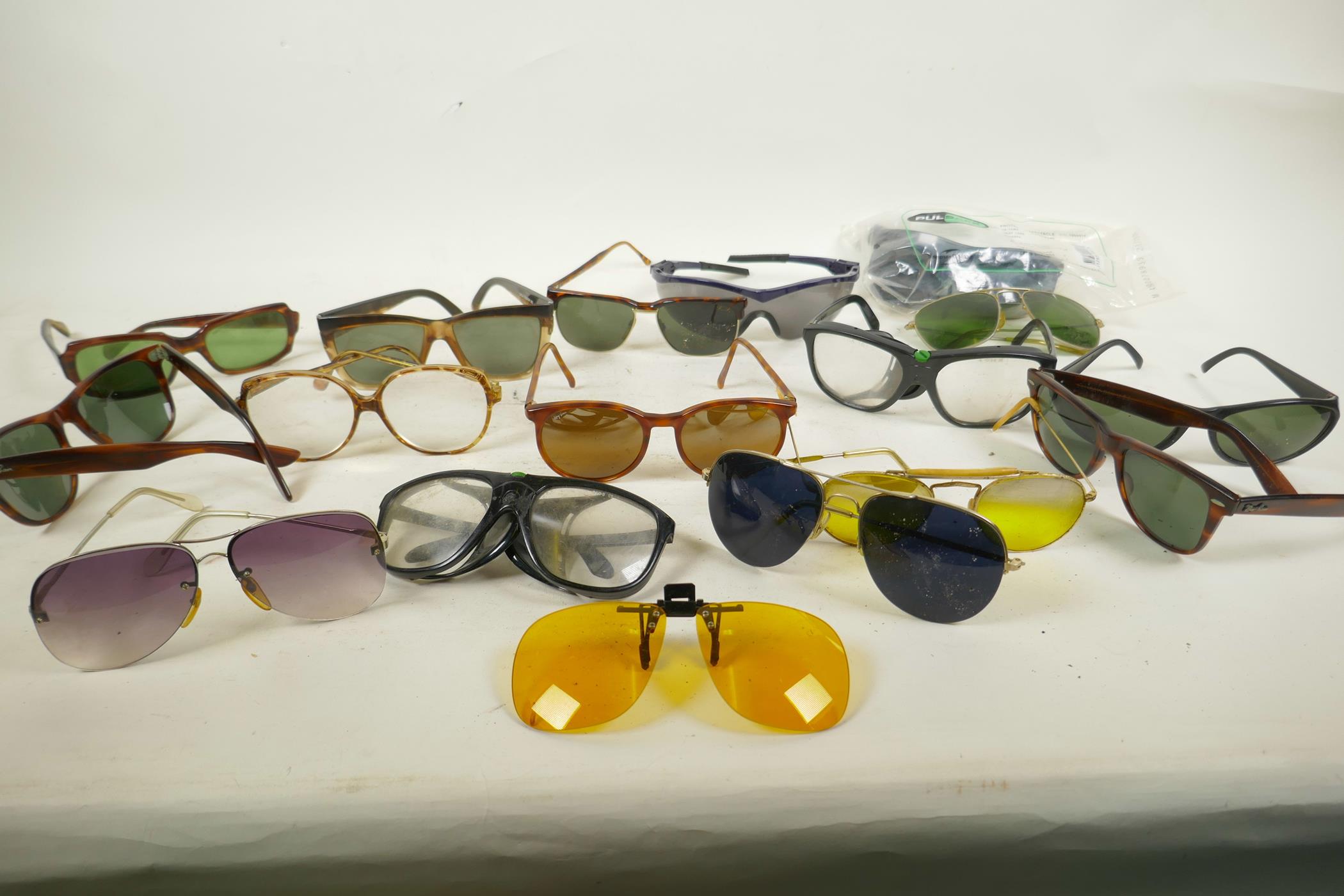 A collection of vintage sunglasses including Ray Bans