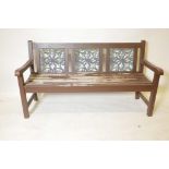 A painted garden bench with inset metal panels, 60" long, 33" high