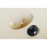 A set of two gemstone, an 8.25ct white opal, oval cabochon and a 1.60ct natural blue sapphire,