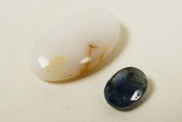 A set of two gemstone, an 8.25ct white opal, oval cabochon and a 1.60ct natural blue sapphire,