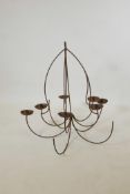 A wrought iron ten branch chandelier, A/F, 33" long