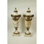 A pair of marble urns with gilt metal mounts and applied garlands, with cast goat mask handles, 18½"