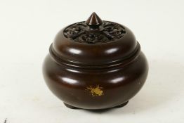 A Chinese gilt splash bronze censer with pierced cover, seal mark to base, 4" diameter