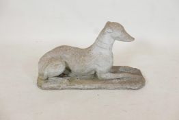 A concrete garden ornament in the form of a greyhound, 26" x 11"