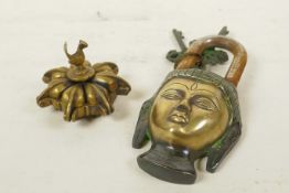An Indian brass tika box with bird decoration and an Indian Buddha padlock, largest 6" long