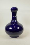 A Chinese powder blue glazed pottery garlic head shaped vase, 13" high