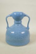 A Chinese duck egg blue glazed porcelain two handled flask/vase with underglaze mythical creature