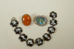 A tortoiseshell bracelet with inset silver decoration, together with a sterling silver and abalone