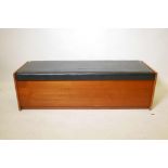 A 1970s teak veneered ottoman, 54" x 18", 17" high