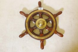 A teak ship's wheel with brass mounts and boss, 16" diameter