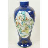 A Chinese blue lustre glazed baluster vase decorated with panels of figures in garden scenes, 10½"