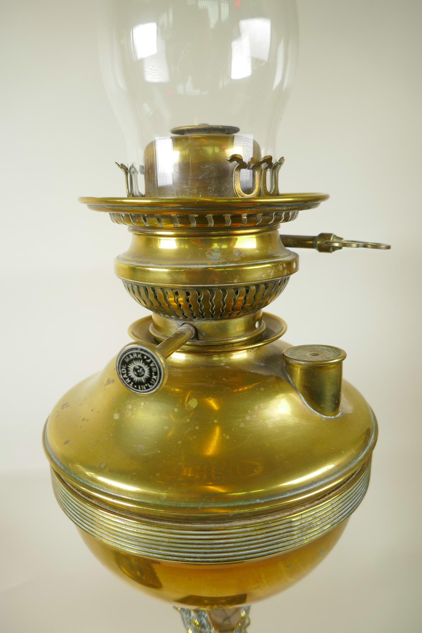 Three late Victorian brass oil lamp burners including glass chimneys, two beautifully cast in a - Image 3 of 6