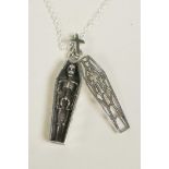 A novelty silver pendant necklace in the form of a coffin containing a skeleton, 1½" drop