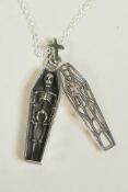 A novelty silver pendant necklace in the form of a coffin containing a skeleton, 1½" drop