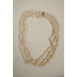 A freshwater pearl and rose quartz triple strand necklace, 18" long