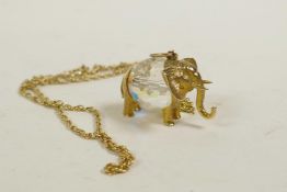 A 9ct gold and crystal elephant pendant on a 9ct gold chain, chain 5 grams, gross 15 grams
