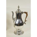A tall, ornate silver plated coffee pot with woven handle, 13" high