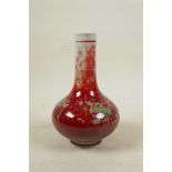 A Chinese porcelain bottle vase with a red and green flambe glaze, 6 character mark to base, 7" high