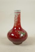 A Chinese porcelain bottle vase with a red and green flambe glaze, 6 character mark to base, 7" high