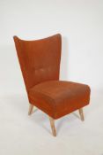 A 1950/60s side chair with shaped back, raised on splay supports