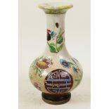 A Chinese crackle glazed pottery bottle vase decorated with butterflies, flowers and symbols, 7"