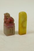 A Chinese yellow soapstone seal with carved bamboo decoration, and another seal with carved kylin