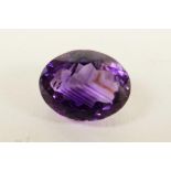 A 6.04ct natural dark purple amethyst, oval mixed cut, certified laboratory tested, with certificate