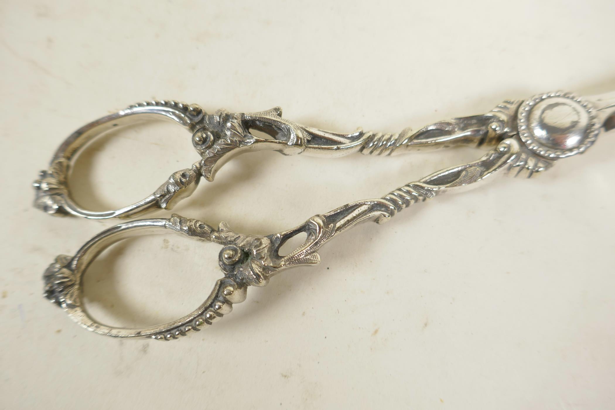 A pair of ornate silver plated grape scissors, 7" long - Image 2 of 2