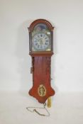 A C19th Dutch oak cased wall clock with weight driven movement striking on a gong, the painted