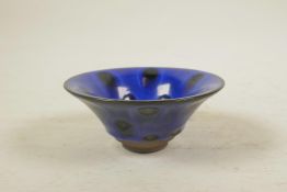 A Chinese Jian style pottery rice bowl with a blue drip glaze, 5" diameter
