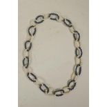 A Tahitian black and white pearl chain link necklace, 28" long