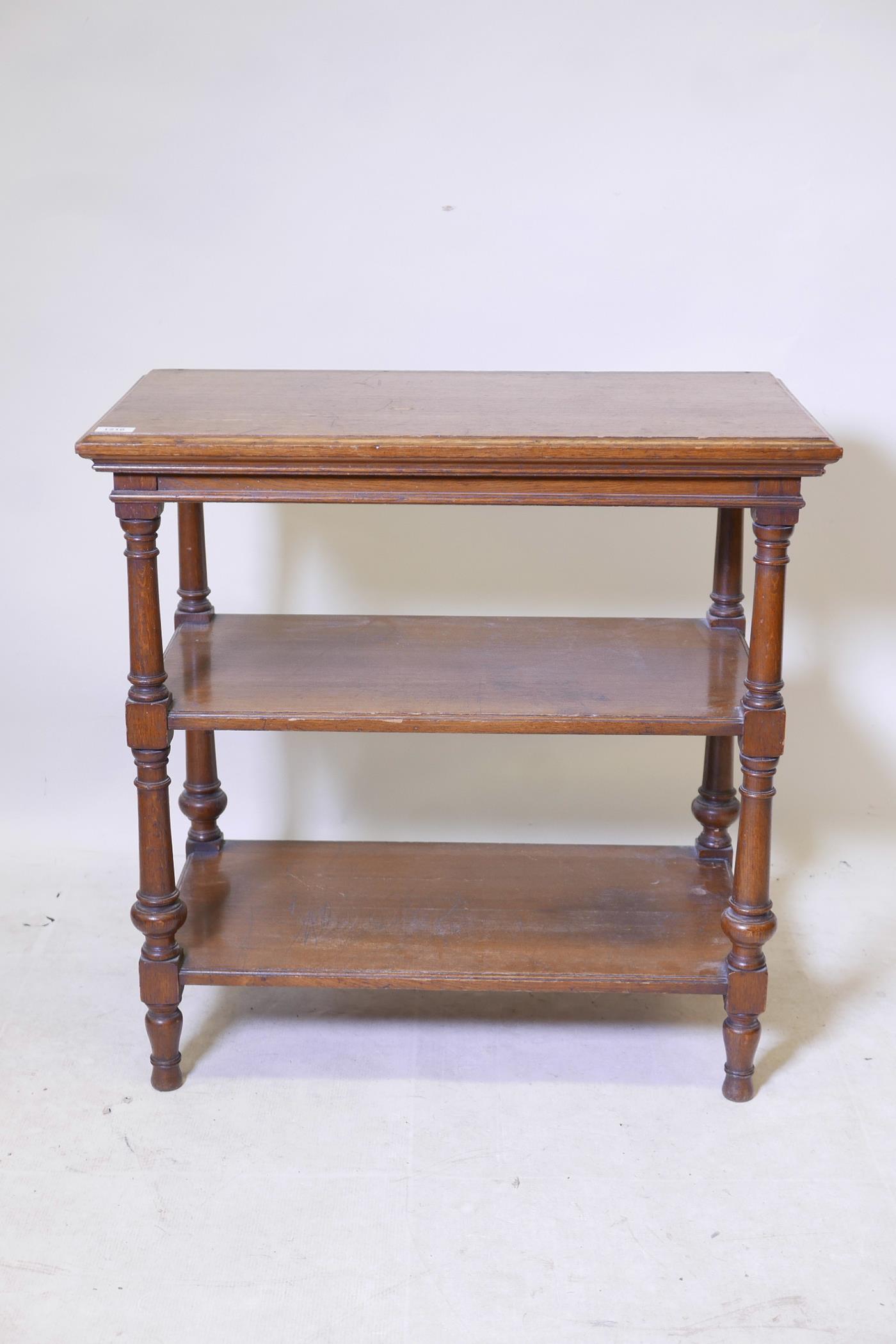 An oak three tier buffet with turned supports, 30" x 16", 30" high