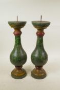A pair of Indian, painted, turned wood candlesticks, 16" high