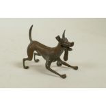 A bronzed metal figure of an enthusiastic dog, modelled the Disney Pixar dog Dante from the film