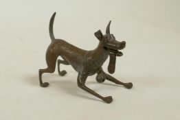 A bronzed metal figure of an enthusiastic dog, modelled the Disney Pixar dog Dante from the film