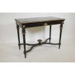 A French Empire style ebonised and gilt metal folding card table with an inset leather top and baize