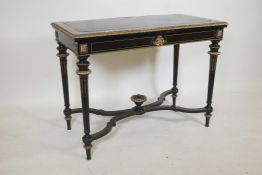 A French Empire style ebonised and gilt metal folding card table with an inset leather top and baize