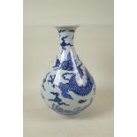 A Chinese blue and white porcelain pear shaped vase decorated with a dragon in flight, 12" high