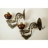 A pair of French, early C20th wall bracket lamps, well cast in scrolling brass with turned wooden