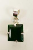 A striking pendant featuring a 12ct square cut natural green emerald, set in sterling silver,