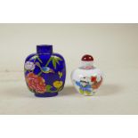 A Peking glass style snuff bottle with enamelled decoration of boys playing, and another in blue