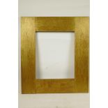 An early C20th Arts and Crafts style gilded oak picture frame, rebate size 12" x 10"