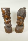 A pair of African carved hardwood head busts of a man and woman, 16" high
