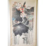 A Chinese watercolour scroll decorated with multicoloured lotus flowers, 25" x 52"