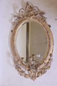 A C19th giltwood and composition wall mirror with laurel leaf and scrolling decoration and three