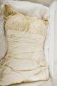 A Ian Stuart cream silk wedding dress and veil