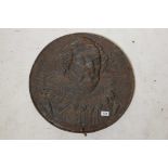 An antique cast iron wall plaque with portrait of William Shakespeare in raised relief, 21" diameter